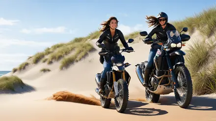 Australian women ridding their dirt bike on sandy trail, dirt flying